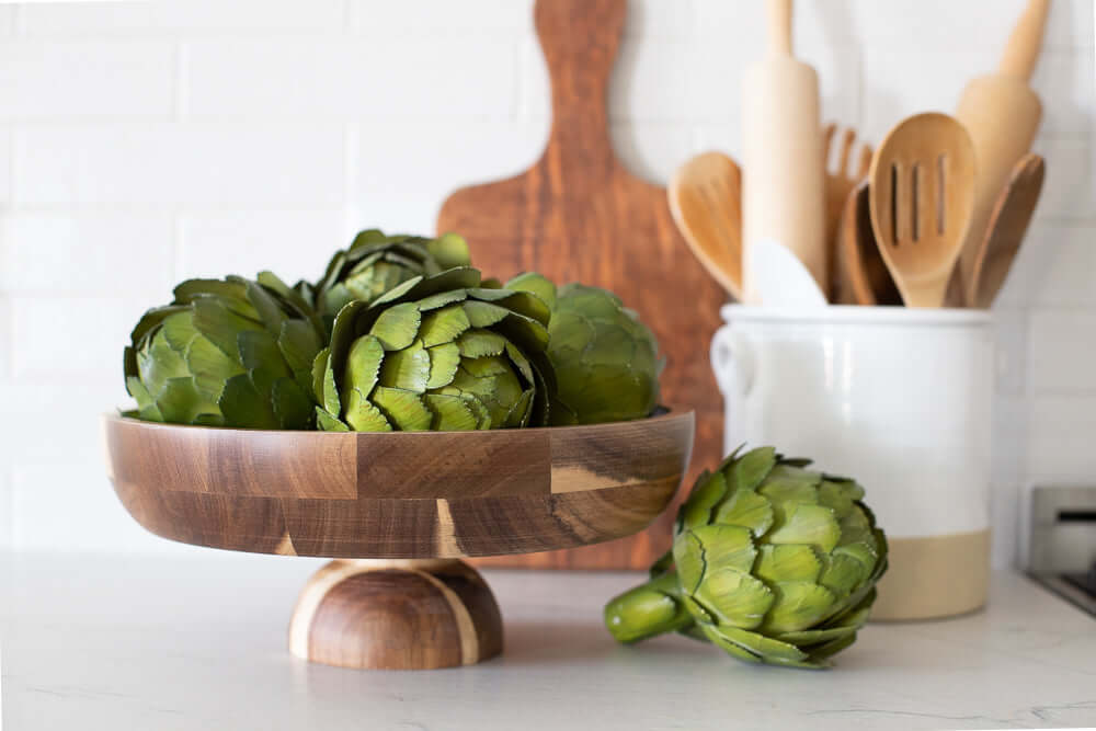 wood serving bowl with artichokes and utensil holder